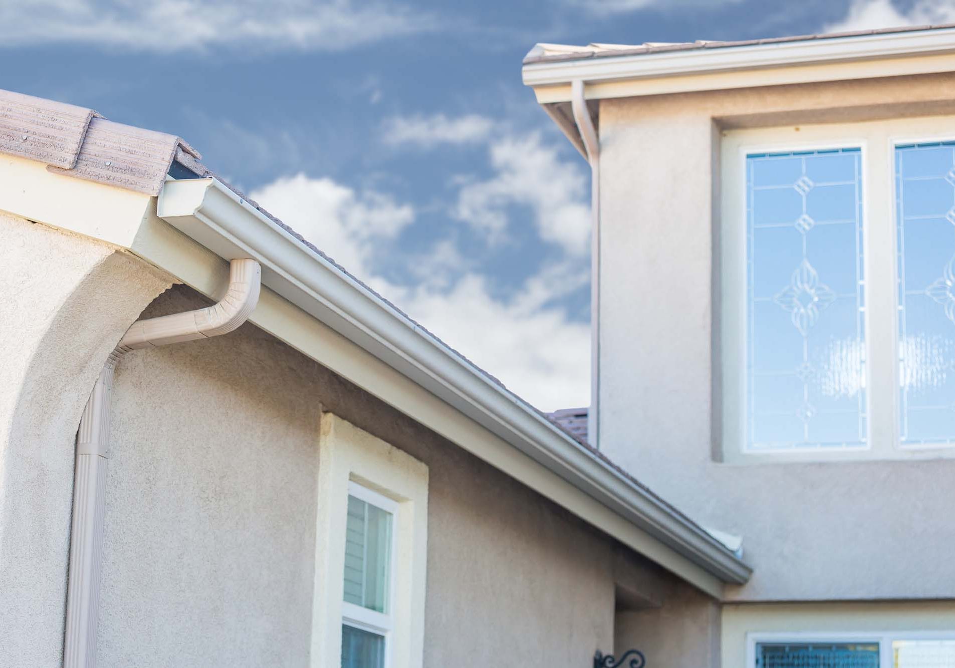 House with A New Seamless Aluminum Rain Gutters.